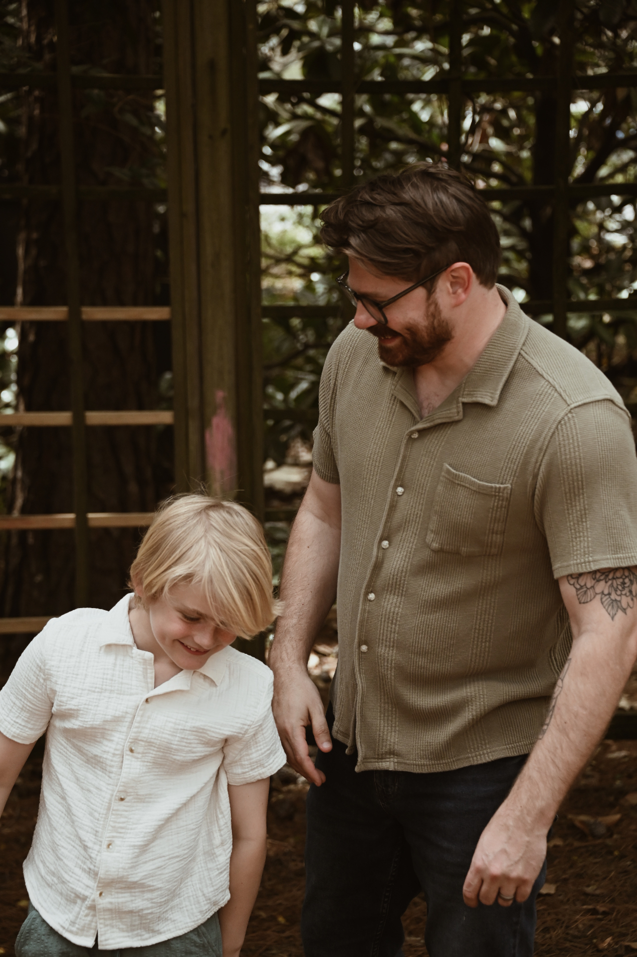 Father and son smiling together outdoors